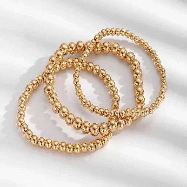 Conjunto de 7 Pulseiras Douradas de Contas