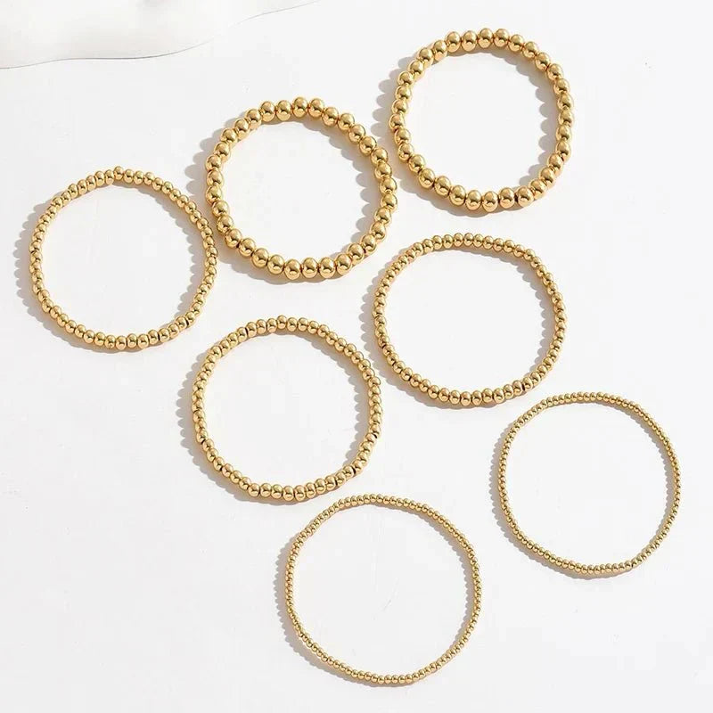 Conjunto de 7 Pulseiras Douradas de Contas