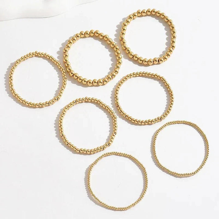 Conjunto de 7 Pulseiras Douradas de Contas