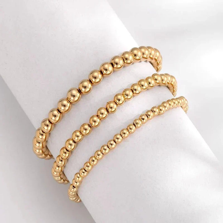 Conjunto de 7 Pulseiras Douradas de Contas