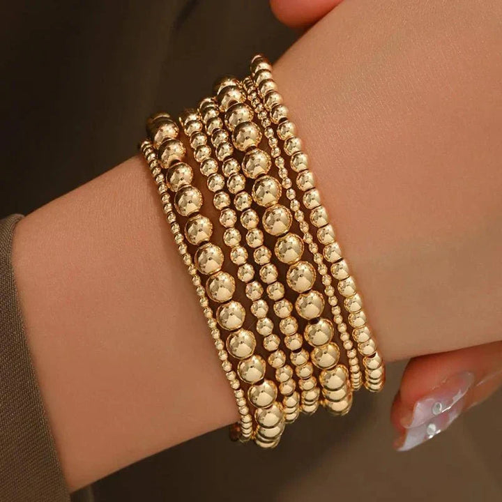 Conjunto de 7 Pulseiras Douradas de Contas