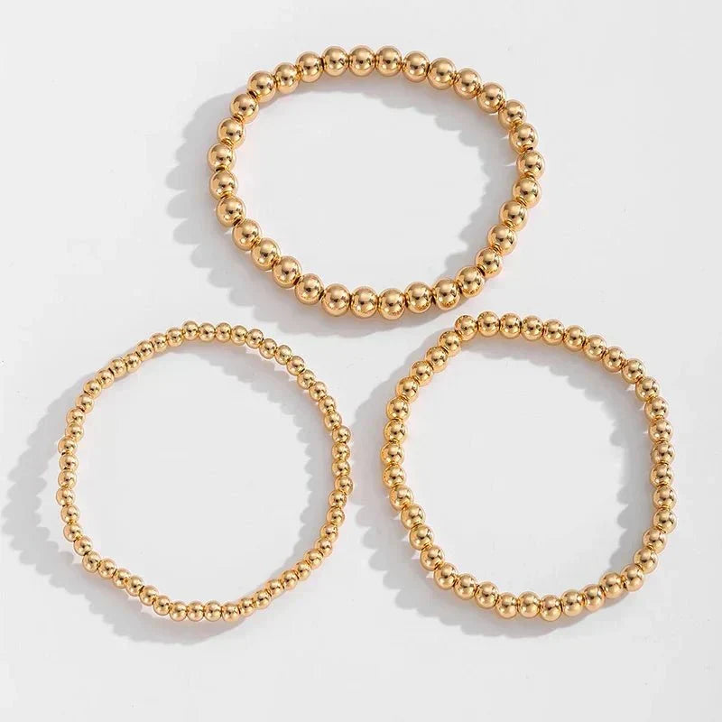 Conjunto de 7 Pulseiras Douradas de Contas