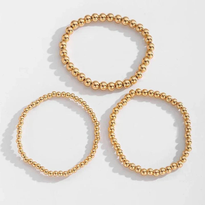 Conjunto de 7 Pulseiras Douradas de Contas