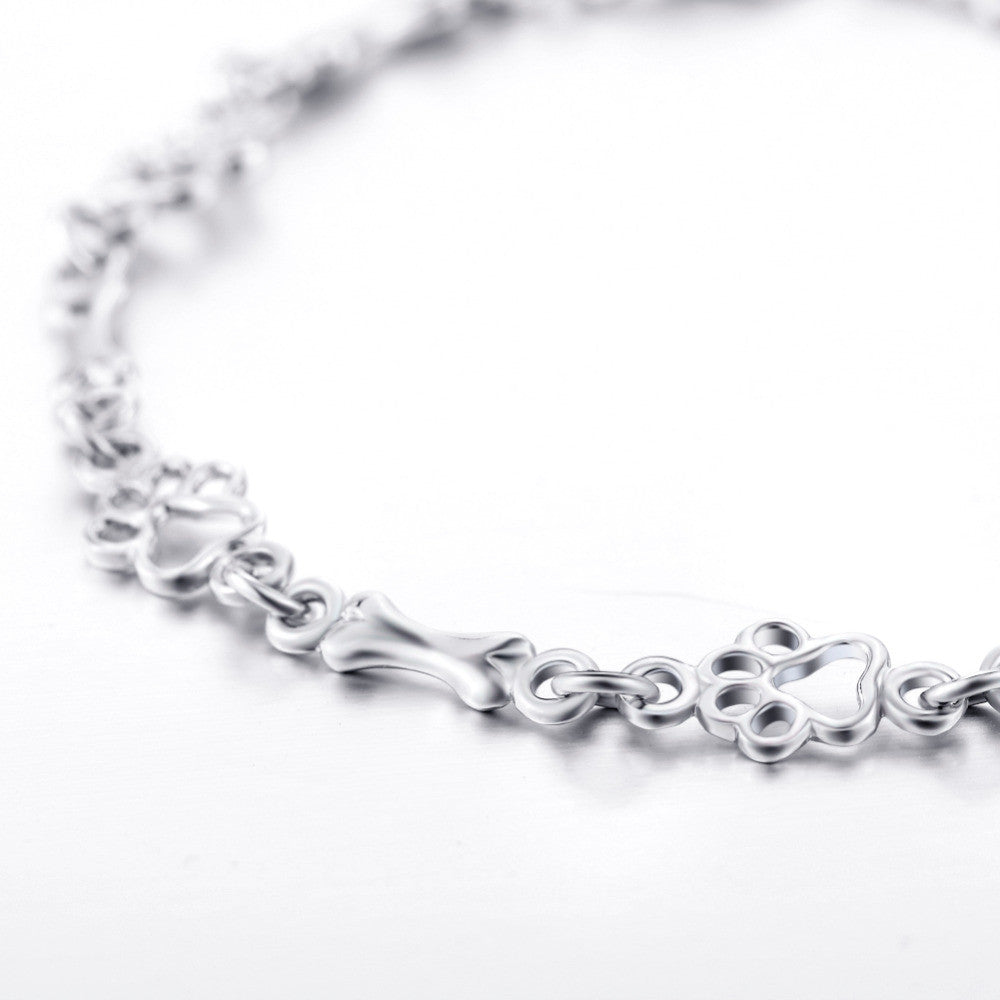 Edição Limitada: Pulseira em Prata de Lei com Pendentes de Pata e Osso