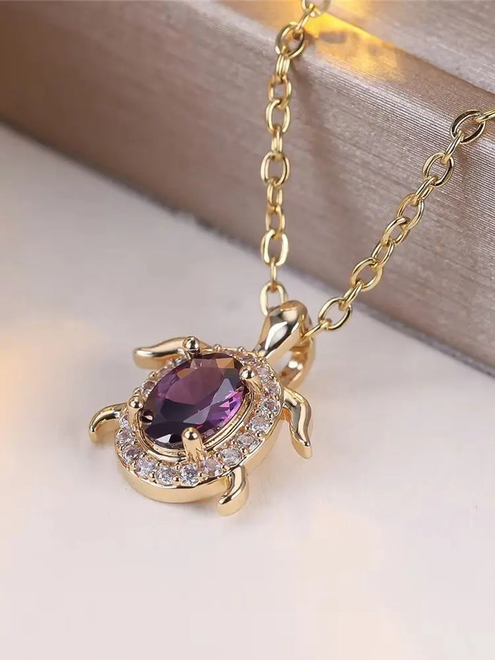 Colar com Tartaruga de Cristal Roxo