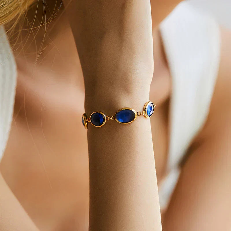 Pulseira Dourada Brilhante com Safira