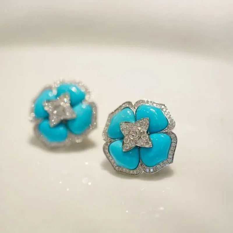 Brincos Prateados Sofisticados com Flor Azul