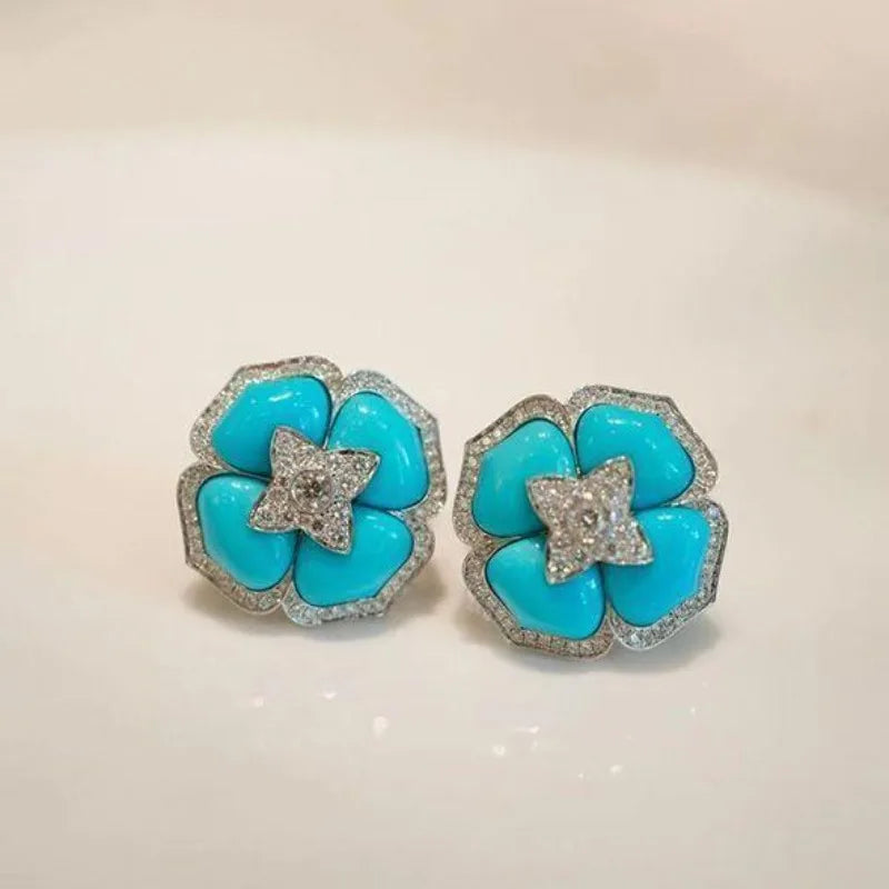 Brincos Prateados Sofisticados com Flor Azul