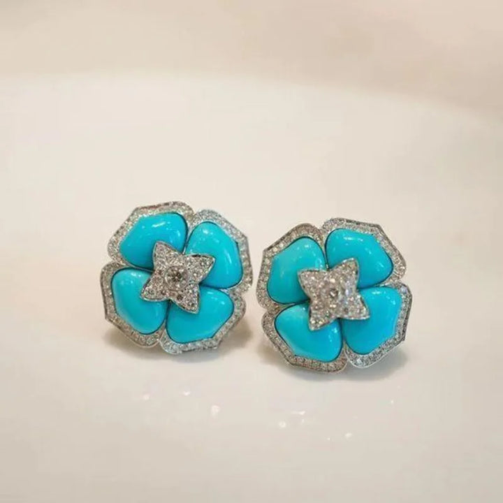 Brincos Prateados Sofisticados com Flor Azul