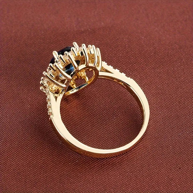 Anel Dourado Brilhante com Safira
