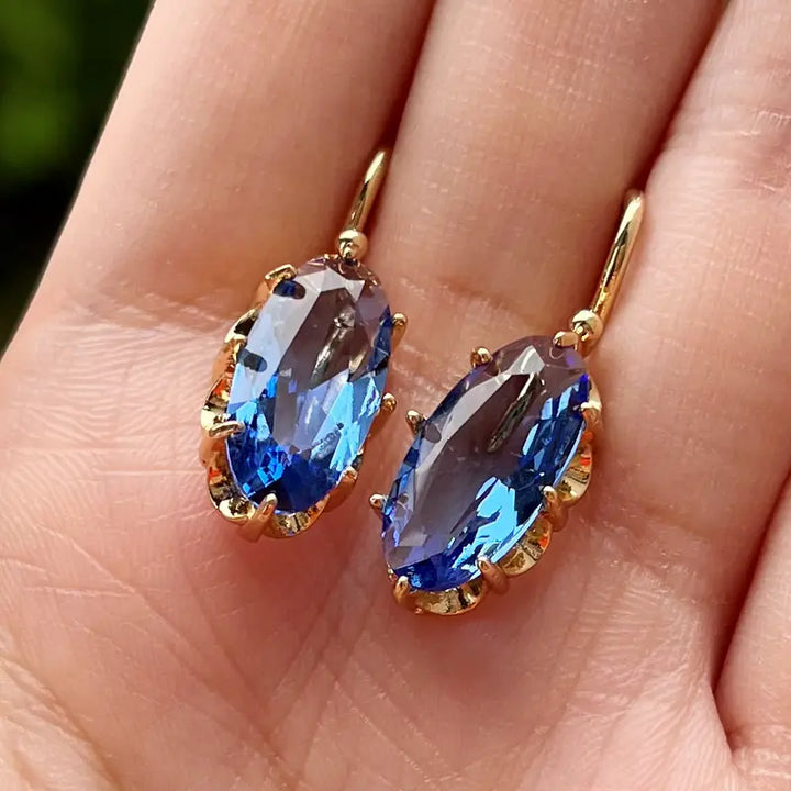 Brincos Dourados com Flor Azul