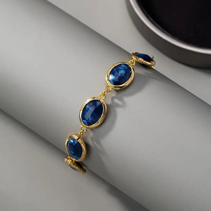 Pulseira Dourada Brilhante com Safira