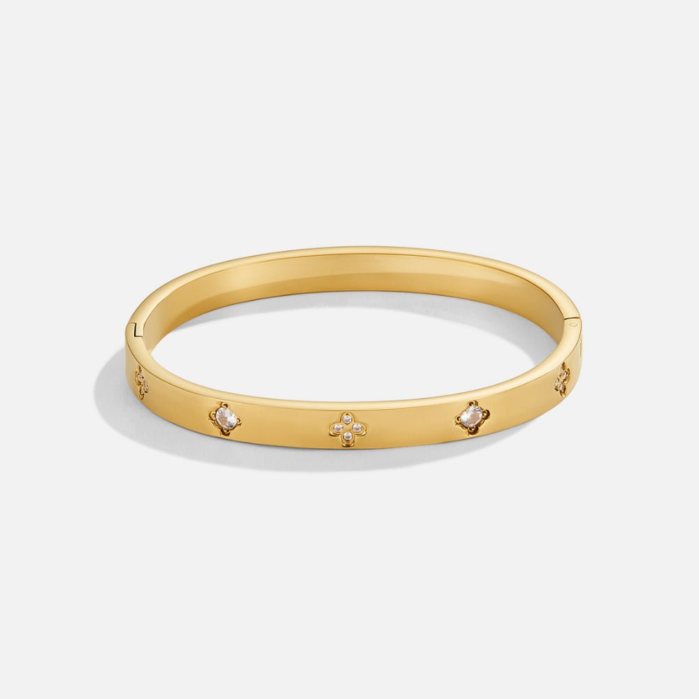 Bracelete Rígida Dourada com Trevo de Quatro Folhas