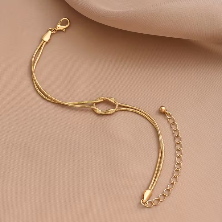 Pulseira Dourada com Laço